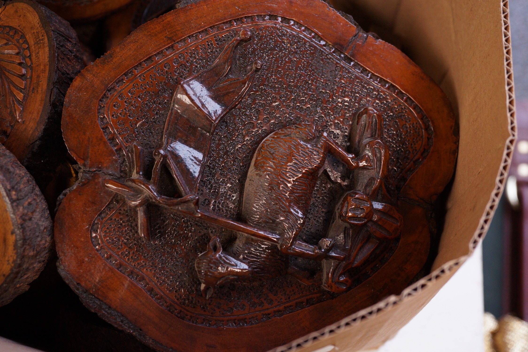 A collection of Jerusalem carved oyster olive wood roundels, religious and other symbolism